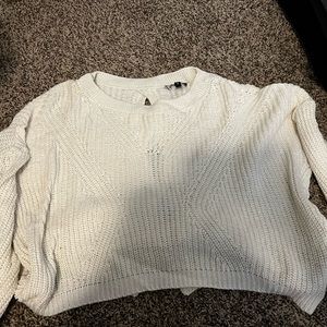 Express cream sweater with designed back